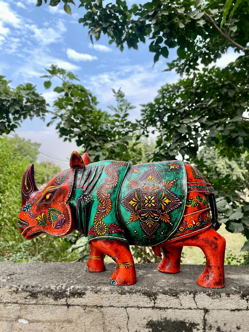 WOODEN PAINTED RHINOCEROS FIGURINE